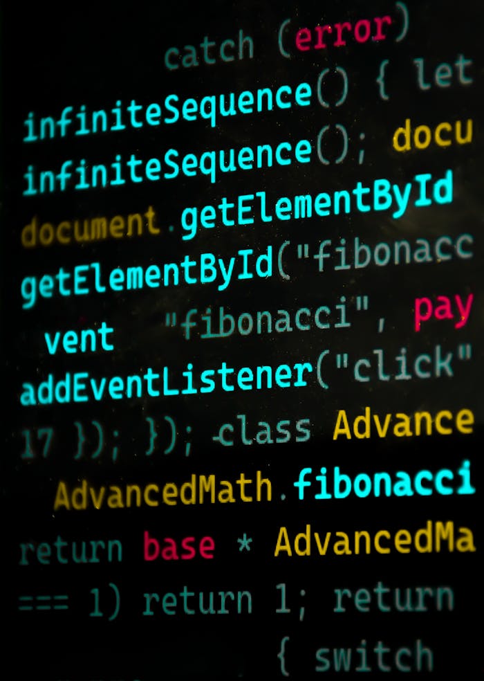services-01 Close-up of vibrant JavaScript code featuring functions and syntax highlighting.